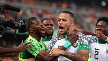 Nigeria's defender #5 William Troost-Ekong (C) celebrates after shooting a penalty and scoring his team's first goal during the Africa Cup of Nations (CAN) 2024 group A football match between Ivory Coast and Nigeria at the Alassane Ouattara Olympic Stadium in Ebimpe, Abidjan, on January 18, 2024. (Photo by FRANCK FIFE / AFP)