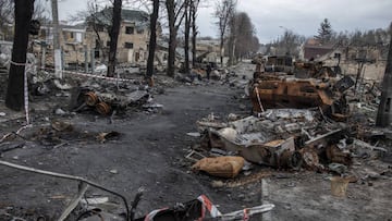 BUCHA, KYIV PROVINCE, UKRAINE - APRIL 06: A civilian walks amid the destruction on a street in the town of Bucha, on the outskirts of Kyiv, after the Ukrainian army secured the area following the withdrawal of the Russian army from the Kyiv region on previous days, Bucha, Ukraine, on April 6, 2022. (Photo by Narciso Contreras/Anadolu Agency via Getty Images)