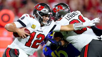 TAMPA, FLORIDA - NOVEMBER 06: Tom Brady #12 of the Tampa Bay Buccaneers scrambles as Bobby Wagner #45 of the Los Angeles Rams gives chase in the third quarter at Raymond James Stadium on November 06, 2022 in Tampa, Florida.   Mike Ehrmann/Getty Images/AFP