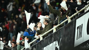 Valencia's supporters wave white handkerchieves at the end of the Spanish league football match between Valencia CF and Real Madrid CF at Mestalla Stadium in Valencia on February 8, 2026. Real Madrid won 0-2. (Photo by JOSE JORDAN / AFP)