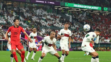 AL RAYYAN, QATAR - DECEMBER 02:  The ball hits the back of Cristiano Ronaldo of Portugal in the lead up to Young-gwon Kim of Korea Republic scoring a goal to make it 1-1 during the FIFA World Cup Qatar 2022 Group H match between Korea Republic and Portugal at Education City Stadium on December 2, 2022 in Al Rayyan, Qatar. (Photo by Chris Brunskill/Fantasista/Getty Images)