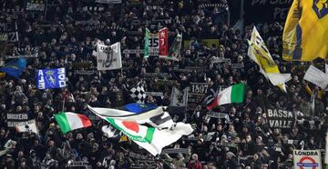 Juventus supporters cheer during the UEFA Champions League round of sixteen first leg football match between Juventus and Tottenham Hotspur at The Allianz Stadium in Turin on February 13, 2018.