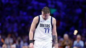 Dallas Mavericks guard Luka Doncic (77) walks down the court during a time out against the Oklahoma City Thunder during the second half at Paycom Center.