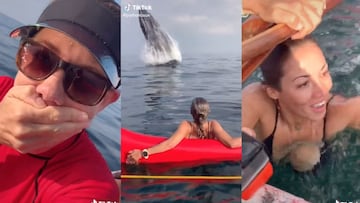 Una ballena salta frente a una chica, que ponen cara de miedo. 