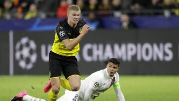 Dortmund's Erling Braut Haaland, left, duels for the ball with PSG's Thiago Silva during the Champions League round of 16 first leg soccer match between Borussia Dortmund and Paris Saint Germain in Dortmund, Germany, Tuesday, Feb. 18, 2020. (AP