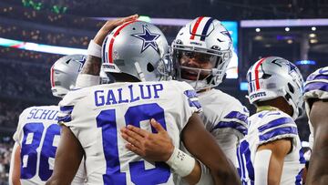 ARLINGTON, TEXAS - DECEMBER 04: Dak Prescott #4 of the Dallas Cowboys celebrates with Michael Gallup #13 of the Dallas Cowboys after a touchdown in the second quarter of a game Indianapolis Colts at AT&T Stadium on December 04, 2022 in Arlington, Texas.   Richard Rodriguez/Getty Images/AFP (Photo by Richard Rodriguez / GETTY IMAGES NORTH AMERICA / Getty Images via AFP)