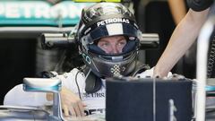 Mercedes driver Nico Rosberg, of Germany, climbs into his car during the second practice session for the Formula One U.S. Grand Prix auto race at the Circuit of the Americas, Friday, Oct. 21, 2016, in Austin, Texas. (AP Photo/Tony Gutierrez)