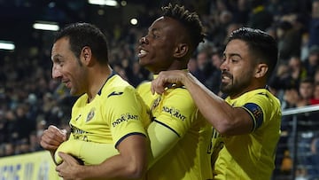 VILLAREAL, SPAIN - JANUARY 03: Santi Cazorla (L) of Villarreal ccelebrates after scoring his sides first goal with his teammates Samuel Chimerenka Chukweze and Jaume Costa (R) during the La Liga match between Villarreal CF and Real Madrid CF at Estadio de