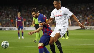 Fernando, junto a Messi. 