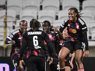 OL-Lyonnes' players celebrate a goal during the UEFA Women's Champions League quarter final second leg football match between OL Lyonnes (Lyon) and VfL Wolfsburg at the Groupama stadium in Decines-Charpieu, central-eastern France, on April 2, 2026. (Photo by JEFF PACHOUD / AFP)