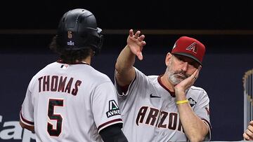 ARLINGTON, TEXAS - OCTOBER 28: Alek Thomas #5 and manager Torey Lovullo of the Arizona Diamondbacks celebrate after Thomas scored a run in the seventh inning against the Texas Rangers during Game Two of the World Series at Globe Life Field on October 28, 2023 in Arlington, Texas. Jamie Squire/Getty Images/AFP (Photo by JAMIE SQUIRE / GETTY IMAGES NORTH AMERICA / Getty Images via AFP)