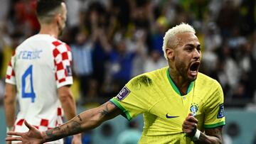 Brazil's forward #10 Neymar celebrates scoring his team's first goal during the Qatar 2022 World Cup quarter-final football match between Croatia and Brazil at Education City Stadium in Al-Rayyan, west of Doha, on December 9, 2022. (Photo by Jewel SAMAD / AFP)