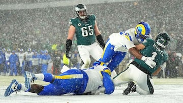 PHILADELPHIA, PENNSYLVANIA - JANUARY 19: Neville Gallimore #92 and Keir Thomas #96 of the Los Angeles Rams tackle Jalen Hurts #1 of the Philadelphia Eagles for a safety during the third quarter in the NFC Divisional Playoff at Lincoln Financial Field on January 19, 2025 in Philadelphia, Pennsylvania. Mitchell Leff/Getty Images/AFP (Photo by Mitchell Leff / GETTY IMAGES NORTH AMERICA / Getty Images via AFP)