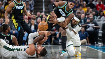 Nov 9, 2023; Indianapolis, Indiana, USA; Indiana Pacers guard Buddy Hield (7) and Milwaukee Bucks forward Jae Crowder (99) fight for a loose ball in the first half at Gainbridge Fieldhouse. Mandatory Credit: Trevor Ruszkowski-USA TODAY Sports