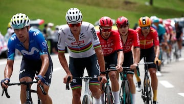 Cycling - Tour de France - Stage 14 - Pau to Saint-Lary-Soulan Pla d'Adet - Pau, France - July 13, 2024 Alpecin - Deceuninck's Mathieu Van Der Poel and Movistar Team's Oier Lazkano in action with riders stage 14 REUTERS/Stephane Mahe