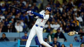 LOS ANGELES, CALIFORNIA - APRIL 3: Shohei Ohtani #17 of the Los Angeles Dodgers hits a solo home run during the seventh inning against the San Francisco Giants at Dodger Stadium on April 3, 2024 in Los Angeles, California. The home run is Ohtani's first as a Dodger.   Kevork Djansezian/Getty Images/AFP (Photo by KEVORK DJANSEZIAN / GETTY IMAGES NORTH AMERICA / Getty Images via AFP)