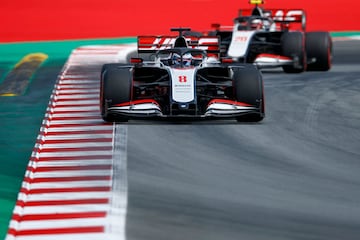 Haas F1's French driver Romain Grosjean steers his car in front of Haas F1's Danish driver Kevin Magnussen during the qualifying session at the Circuit de Catalunya in Montmelo near Barcelona on August 15, 2020 ahead of the Spanish F1 Grand Prix. (Photo by Alejandro Garcia / POOL / AFP)