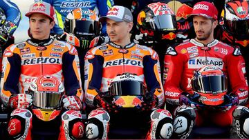 2019 season MotoGP riders (From L) Repsol Honda's Marc Marquez and Jorge Lorenzo, Mission Winnow Ducati's Andrea Dovizioso pose for a group picture in Doha on March 7, 2019 at Losail Circuit ahead of the season's start at Qatar MotoGP grand prix on March 10. (Photo by KARIM JAAFAR / AFP)