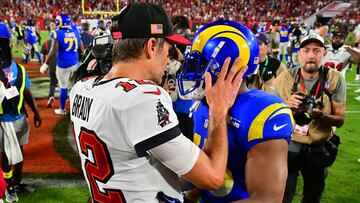 TAMPA, FLORIDA - NOVEMBER 06: Tom Brady #12 of the Tampa Bay Buccaneers and Bobby Wagner #45 of the Los Angeles Rams embrace after their game at Raymond James Stadium on November 06, 2022 in Tampa, Florida.   Julio Aguilar/Getty Images/AFP