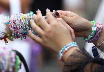 Taylor Swift fans exchange bracelets ahead of the concert in Singapore, March 8, 2024.