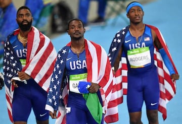 USA's Tyson Gay, Justin Gatlin and Michael Rodgers react after being disqualified of the Men's 4x100m Relay Final.