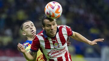 Alvaro Fidalgo (L) of America fights for the ball with Fernando Gonzalez (R) of Guadalajara during the round of 16 second leg match between America and Guadalajara - Round of 16as part of the CONCACAF Champions Cup 2024, at Azteca Stadium on March 13, 2024 in Mexico City, Mexico.