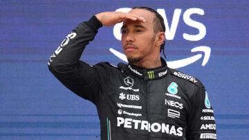 Second placed Mercedes' British driver Lewis Hamilton gestures on the podium after the Spanish Formula One Grand Prix race at the Circuit de Catalunya on June 4, 2023 in Montmelo, on the outskirts of Barcelona. (Photo by Josep LAGO / AFP)