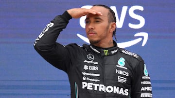 Second placed Mercedes' British driver Lewis Hamilton gestures on the podium after the Spanish Formula One Grand Prix race at the Circuit de Catalunya on June 4, 2023 in Montmelo, on the outskirts of Barcelona. (Photo by Josep LAGO / AFP)