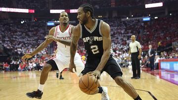 May 5, 2017; Houston, TX, USA; San Antonio Spurs forward Kawhi Leonard (2) dribbles against Houston Rockets forward Trevor Ariza (1) in the second half in game three of the second round of the 2017 NBA Playoffs at Toyota Center. San Antonio won 103-92. Mandatory Credit: Thomas B. Shea-USA TODAY Sports