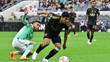 LAFC's Spanish-Mexican forward Carlos Vela vies for the ball with Leon's Mexican midfielder Fidel Ambriz during the CONCACAF Champions League final leg 2 of 2 match between Los Angeles Football Club and Club Leon at the BMO Stadium in Los Angeles, June 4, 2023. (Photo by Frederic J. BROWN / AFP)