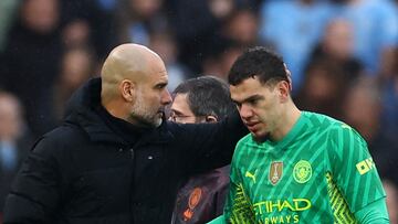 Soccer Football - Premier League - Liverpool v Manchester City - Anfield, Liverpool, Britain - March 10, 2024 Manchester City's Ederson with manager Pep Guardiola after being substituted after sustaining an injury REUTERS/Carl Recine NO USE WITH UNAUTHORIZED AUDIO, VIDEO, DATA, FIXTURE LISTS, CLUB/LEAGUE LOGOS OR 'LIVE' SERVICES. ONLINE IN-MATCH USE LIMITED TO 45 IMAGES, NO VIDEO EMULATION. NO USE IN BETTING, GAMES OR SINGLE CLUB/LEAGUE/PLAYER PUBLICATIONS.