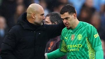 Soccer Football - Premier League - Liverpool v Manchester City - Anfield, Liverpool, Britain - March 10, 2024 Manchester City's Ederson with manager Pep Guardiola after being substituted after sustaining an injury REUTERS/Carl Recine NO USE WITH UNAUTHORIZED AUDIO, VIDEO, DATA, FIXTURE LISTS, CLUB/LEAGUE LOGOS OR 'LIVE' SERVICES. ONLINE IN-MATCH USE LIMITED TO 45 IMAGES, NO VIDEO EMULATION. NO USE IN BETTING, GAMES OR SINGLE CLUB/LEAGUE/PLAYER PUBLICATIONS.