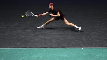 Italy's Jannik Sinner plays a forehand return to Germany's Alexander Zverev during their men's singles semi-final match on day six of the Paris ATP Masters 1000 tennis tournament at the Paris La D�fense Arena in Nanterre, on the outskirts of Paris, on November 1, 2025. (Photo by Dimitar DILKOFF / AFP)