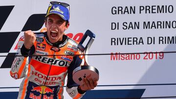 Race winner Repsol Honda Team Spanish rider, Marc Marquez celebrates on the podium following the San Marino MotoGP Grand Prix race at the Misano World Circuit Marco Simoncelli on September 15, 2019. (Photo by Marco Bertorello / AFP)