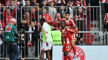 Bayern Munich's Senegalese forward #11 Nicolas Jackson celebrates scoring his team's second goal 2:1 with Bayern Munich's Colombian forward #14 Luis Diaz during the German first division Bundesliga football match between FC Bayern Munich and VfB Stuttgart in Munich, southern Germany, on April 19, 2026. (Photo by Alexandra BEIER / AFP) / DFL REGULATIONS PROHIBIT ANY USE OF PHOTOGRAPHS AS IMAGE SEQUENCES AND/OR QUASI-VIDEO