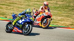 Spanish Honda rider Marc Marquez (R) and Italian Yamaha rider Valentino Rossi compete in the training session of the Moto GP for the Grand Prix of Germany at the Sachsenring Circuit on July 14, 2018 in Hohenstein-Ernstthal, eastern Germany.  / AFP PHOTO / Robert MICHAEL