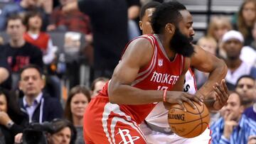 Jan 8, 2017; Toronto, Ontario, CAN; Houston Rockets guard James Harden (13) dribbles the ball past Toronto Raptors guard Kyle Lowry (7) in the second half at Air Canada Centre. Mandatory Credit: Dan Hamilton-USA TODAY Sports