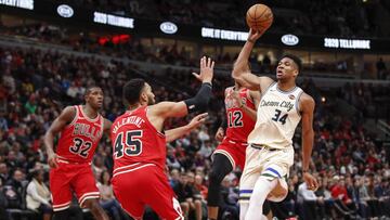 Dec 30, 2019; Chicago, Illinois, USA; Milwaukee Bucks forward Giannis Antetokounmpo (34) drives to the basket against Chicago Bulls guard Denzel Valentine (45) during the first half at United Center. Mandatory Credit: Kamil Krzaczynski-USA TODAY Sports