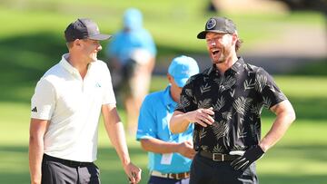 Actor Jensen Ackles laughs with Ludvig Aberg of Sweden on the fifth hole during the pro-am prior to the Sony Open in Hawaii at Waialae Country Club.