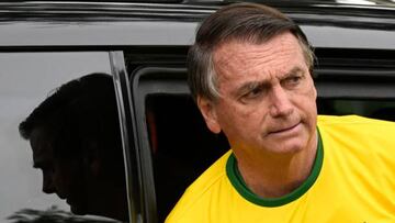 Brazilian president and re-election candidate Jair Bolsonaro arrives at a polling station to vote during the legislative and presidential election, in Rio de Janeiro, Brazil, on October 2, 2022. - Voting began early Sunday in South America's biggest economy, plagued by gaping inequalities and violence, where voters ar expected to choose between far-right incumbent Jair Bolsonaro and leftist front-runner Luiz Inacio Lula da Silva, any of which must garner 50 percent of valid votes, plus one, to win in the first round. (Photo by MAURO PIMENTEL / AFP) (Photo by MAURO PIMENTEL/AFP via Getty Images)