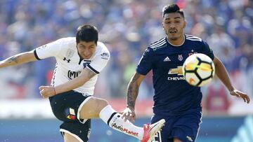 Futbol, Universidad de Chile vs Colo Colo
Novena fecha, campeonato nacional 2018
El jugador de Colo Colo Jaime Valdes, izquierda, disputa el balon con Lorenzo Reyes de Universidad de Chile durante el partido de primera division en el estadio Nacional de Santiago, Chile.
15/04/2018
Andres Pina/Photosport
Football, Universidad de Chile vs Colo Colo
9th date, National Championship 2018
Colo Colo's player Jaime Valdes, left, battles for the ball against Lorenzo Reyes of Universidad de Chile during the first division football match held at the National stadium in Santiago, Chile.
15/04/2018
Andres Pina/Photosport
