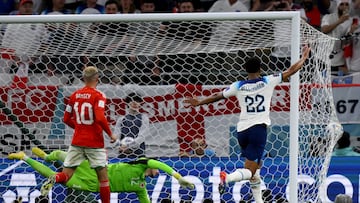 England's forward #11 Marcus Rashford (out of frame) scored his team's first goal from a free-kick past Wales' goalkeeper #12 Danny Ward during the Qatar 2022 World Cup Group B football match between Wales and England at the Ahmad Bin Ali Stadium in Al-Rayyan, west of Doha on November 29, 2022. (Photo by NICOLAS TUCAT / AFP)