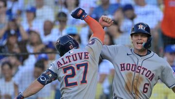 Jul 4, 2025; Los Angeles, California, USA; Houston Astros outfielder Jose Altuve (27) celebrates a 2 run home run with outfielder Jake Meyers (6) during the third inning against the Los Angeles Dodgers at Dodger Stadium. Mandatory Credit: Jayne Kamin-Oncea-Imagn Images