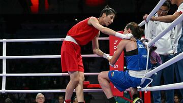 Taiwan's Lin Yu-ting reacts after beating Bulgaria's Svetlana Kamenova Staneva (Blue) in the women's 57kg quarter-final boxing match during the Paris 2024 Olympic Games at the North Paris Arena, in Villepinte on August 4, 2024. (Photo by MOHD RASFAN / AFP)