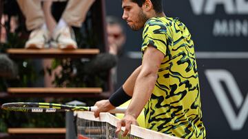 Spain's Carlos Alcaraz reacts by the net during his third round match against Hungary's Fabian Marozsan of the Men's ATP Rome Open tennis tournament at Foro Italico in Rome on May 15, 2023. (Photo by Tiziana FABI / AFP)