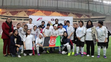 Afghan players pose for a picture after a friendly football match between the women football teams of Qatar and Afghanistan at the Khalifa International Stadium in Doha on November 10, 2021. - Afghan women athletes fled Taliban rule on October 20, 2021 in