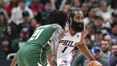 Philadelphia 76ers guard James Harden (1) brings the ball up the court against Milwaukee Bucks guard Jrue Holiday (21) in the second half at Fiserv Forum.