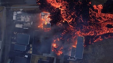 Lava flows from a volcano as houses burn in Grindavik, Iceland, January 14, 2024, in this screen grab obtained from a social media video. Bjorn Steinbekk/@bsteinbekk via Instagram/via REUTERS  THIS IMAGE HAS BEEN SUPPLIED BY A THIRD PARTY. MANDATORY CREDIT. NO RESALES. NO ARCHIVES.