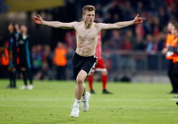 A fan invades the pitch after the match.