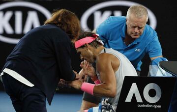 Tennis - Australian Open - Quarterfinals - Rod Laver Arena, Melbourne, Australia, January 23, 2018. Spain's Rafael Nadal receives medical attention during his match against Croatia's Marin Cilic. REUTERS/Edgar Su